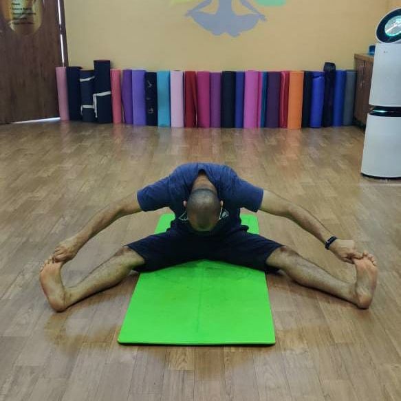 image of client doing yoga